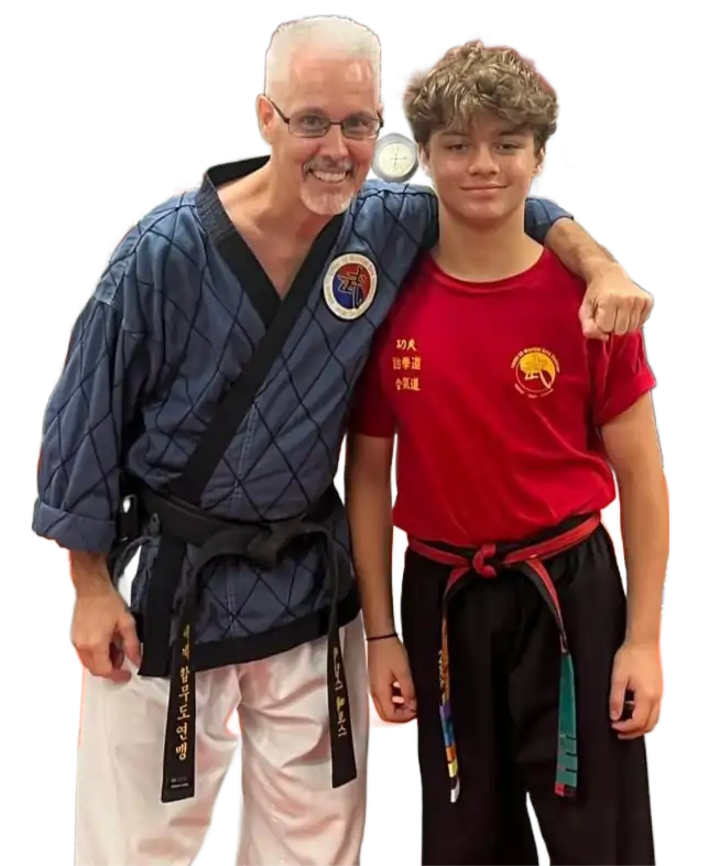 Level 10 Martial Arts instructor with teen martial arts student in Palm Harbor, Florida
