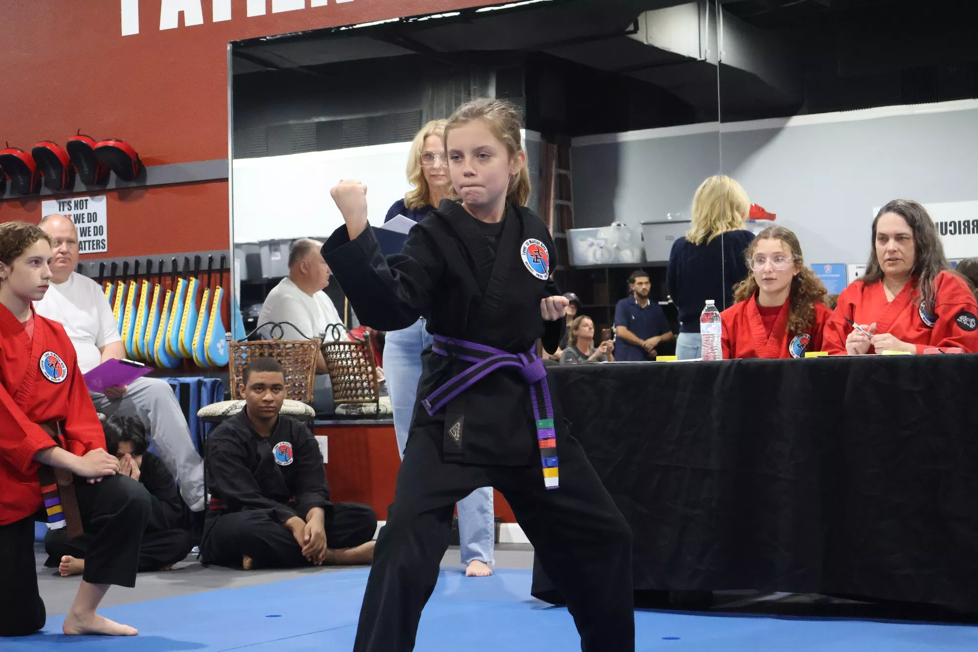 Young martial arts student practicing a blocking technique at Level 10 Martial Arts